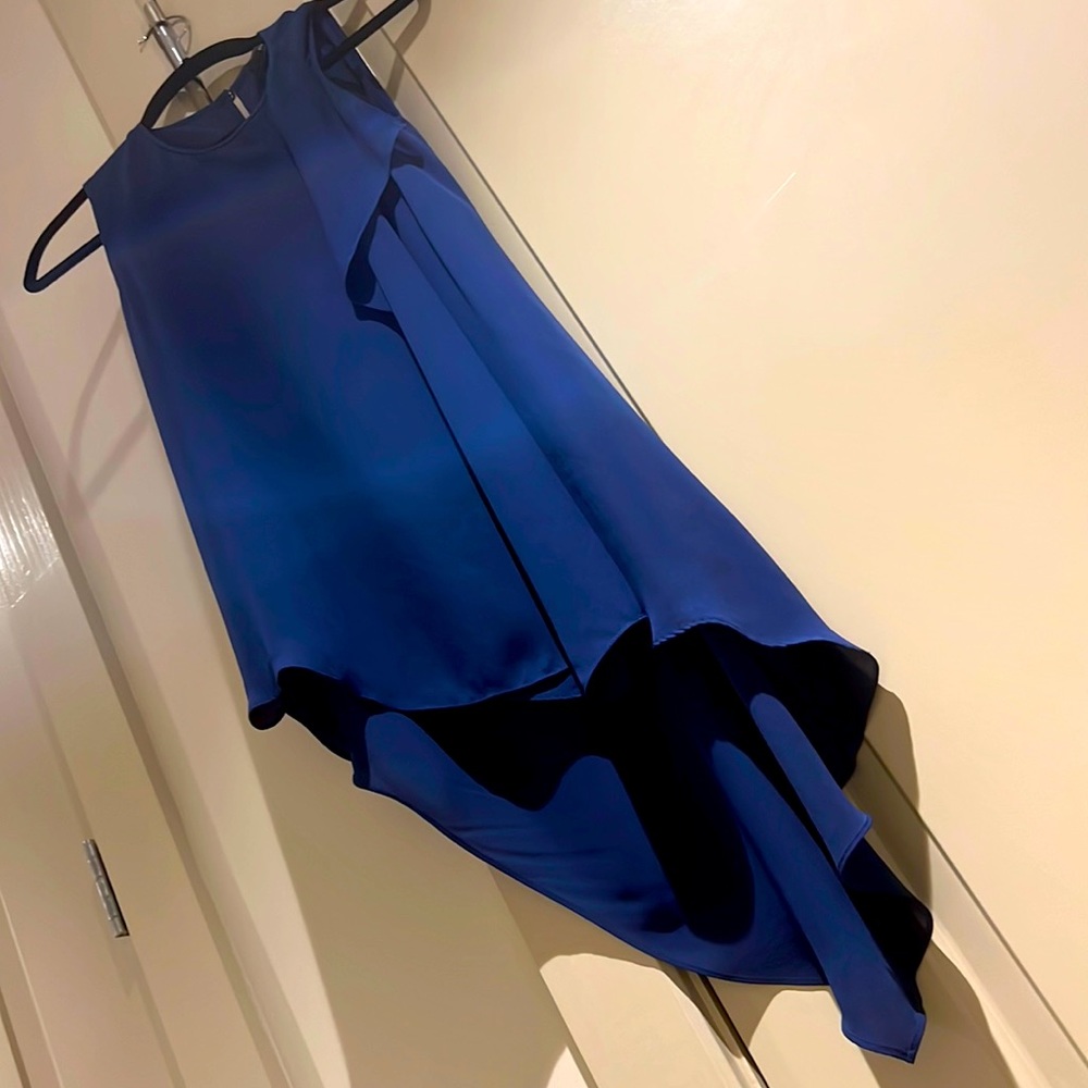 Asymmetric navy blue BCBG sleeveless top.